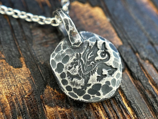 Distressed sterling silver charm pendant with a Welsh dragon
