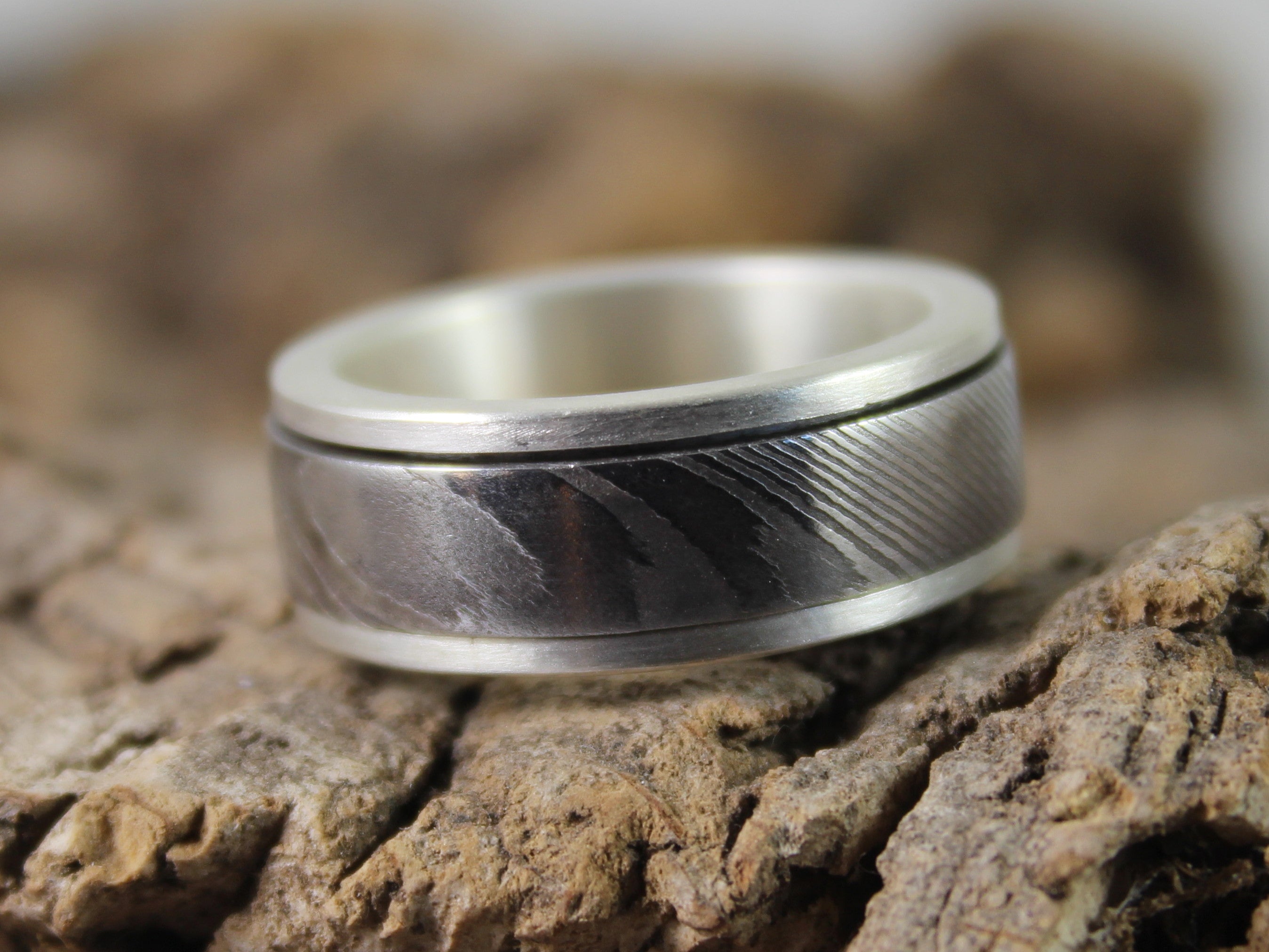 Silver & Damascus Steel Spinner Ring – Dan Rees Jewellery